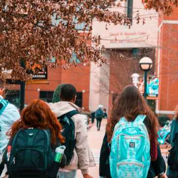 students with backpacks, going to school