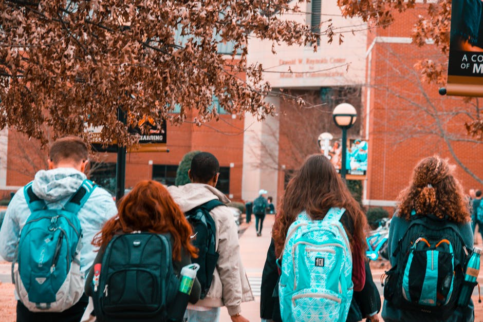 students with backpacks, going to school